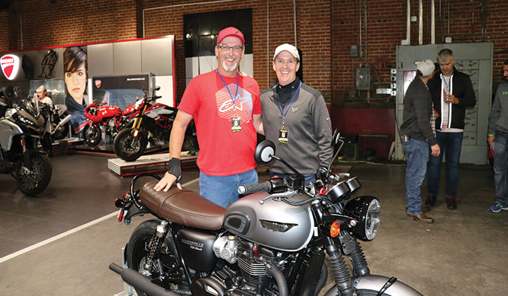 Triumph Motorcycle Contest winner John West with Scott O'Sullivan