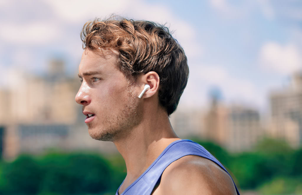 Runner wearing earbuds