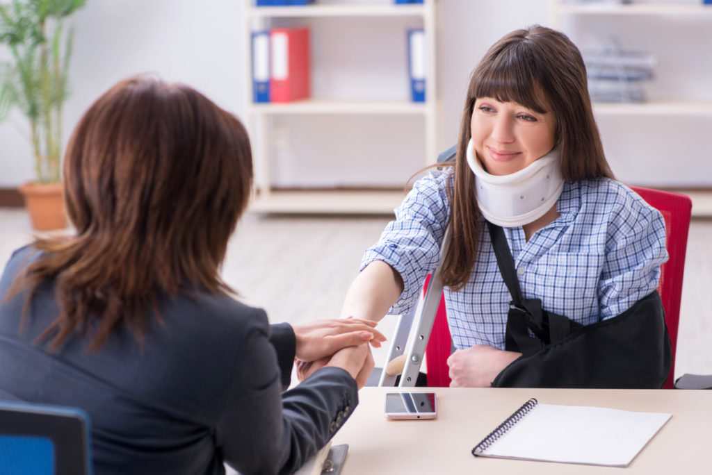 image of lawyer with injured woman | denver personal injury lawyer