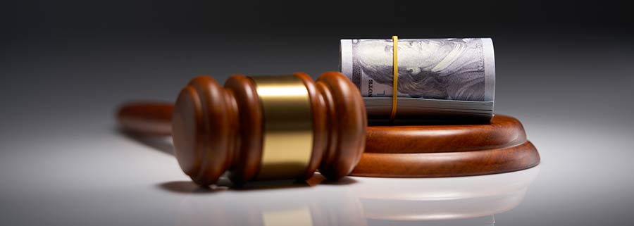Gavel and a roll of money. How to ensure you receive maximum compensation after a car accident