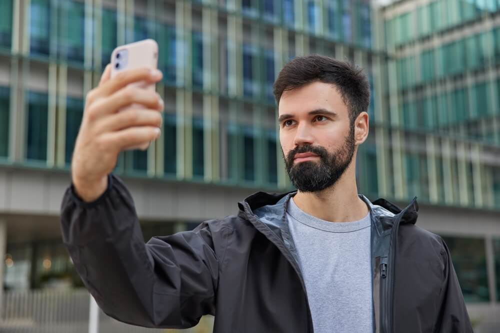Man takes selfie for social media