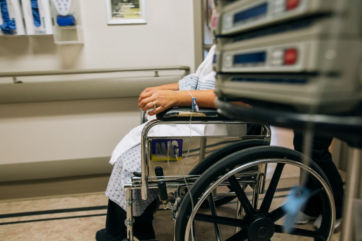 person in a wheelchair after a colorado car crash